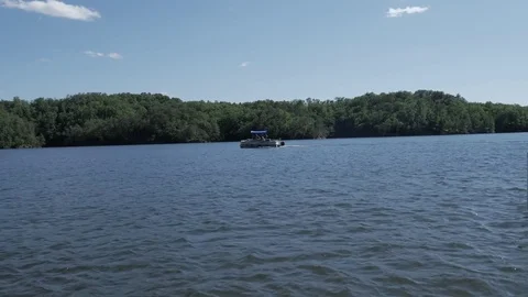 A ship sailing on a river Stock Footage 75386056