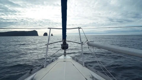 Ship sailing on sea waves on cloudy horizon background view from bow Stock Footage 120777843