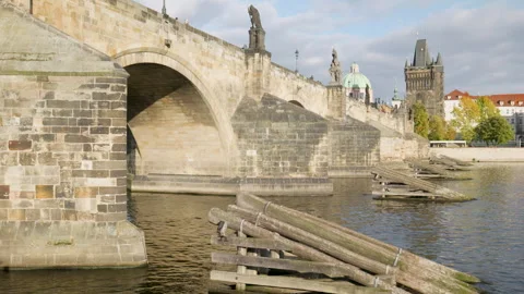 A ship sailing under the Charles Bridge Stock Footage 253405692