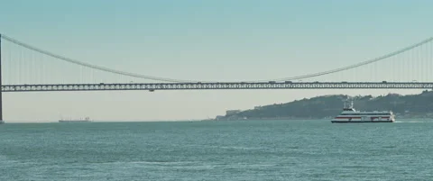 A ship sailing under suspension bridge Stock Footage 151390992