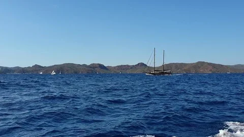 Ship sailing on the waves of the blue sea Stock Footage 117193513
