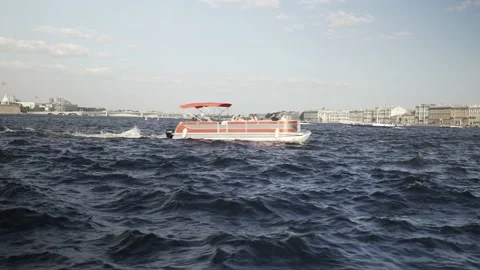 The ship sails along the bay, the river against the backdrop of the city Stock Footage 205376288