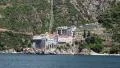 Ship sails along peninsula of Athos, autonomous monastic state in Greece HD Footage