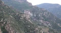 Ship sails along peninsula of Athos, autonomous monastic state in Greece HD Footage