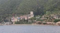 Ship sails along peninsula of Athos, autonomous monastic state in Greece HD Footage