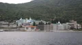 Ship sails along peninsula of Athos, autonomous monastic state in Greece HD Footage