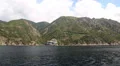 Ship sails along peninsula of Athos, autonomous monastic state in Greece HD Footage