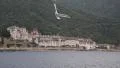 Ship sails along peninsula of Athos, autonomous monastic state in Greece HD Footage