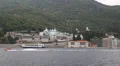 Ship sails along peninsula of Athos, autonomous monastic state in Greece HD Footage