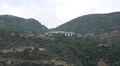 Ship sails along peninsula of Athos, autonomous monastic state in Greece HD Footage