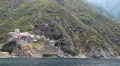 Ship sails along peninsula of Athos, autonomous monastic state in Greece HD Footage