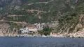 Ship sails along peninsula of Athos, autonomous monastic state in Greece HD Footage