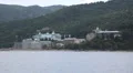 Ship sails along peninsula of Athos, autonomous monastic state in Greece HD Footage