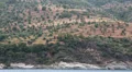 Ship sails along peninsula of Athos, autonomous monastic state in Greece HD Footage