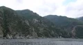 Ship sails along peninsula of Athos, autonomous monastic state, Greece HD Footage
