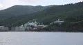 Ship sails along peninsula of Athos, autonomous monastic state, Greece HD Footage