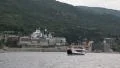 Ship sails along peninsula of Athos, autonomous monastic state in Greece HD Footage