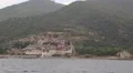 Ship sails along peninsula of Athos, autonomous monastic state in Greece HD Footage