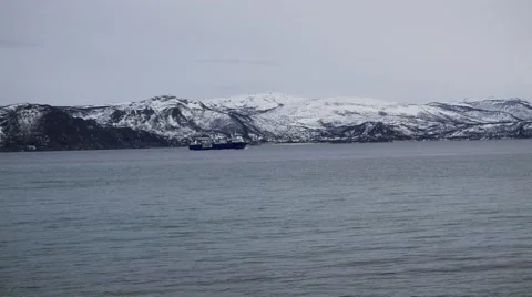 The ship sails on a background of mountains on the sea in northern Norway. Stock Footage 62390774
