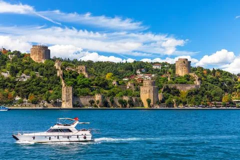 The ship sails in the Bosphorus strait by Rumeli Hisari castle, Istanbul Stock Photos