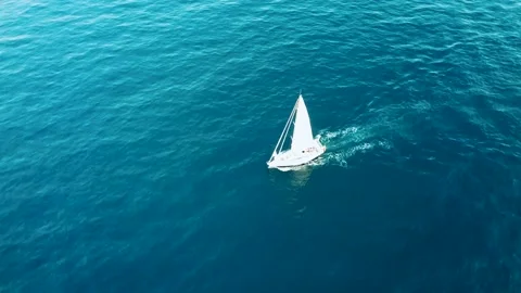 A ship with sails cuts through the calm sea Stock Footage 239541265