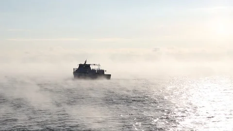 Ship sails on the lake Baikal floating from frost in January Stock Footage 100714162