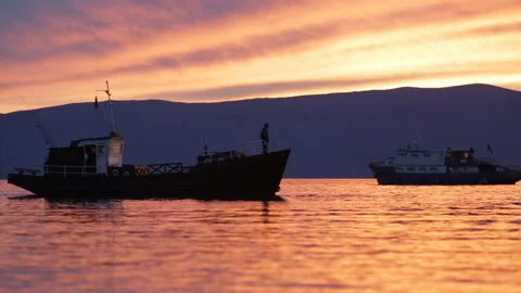 Ship sails on the lake sunset background Stock Footage 94106368