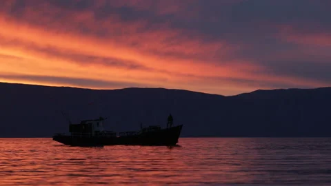 Ship sails on the lake sunset background Stock Footage 94106394