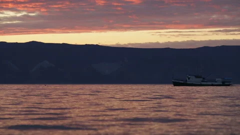 Ship sails on the lake sunset background Stock Footage 94106453