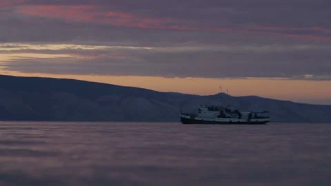 Ship sails on the lake sunset background Stock Footage 94106499