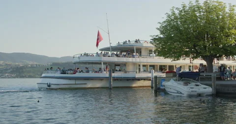 The ship sails from the pier, Staff, Lake Zurich, 4k DCI. Stock Footage 200301324