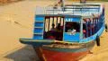 Ship sails on the river to the Tonle Sap lake in Siem Reap province, Cambodia HD Footage
