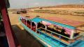 Ship sails on the river to the Tonle Sap lake in Siem Reap province, Cambodia HD Footage