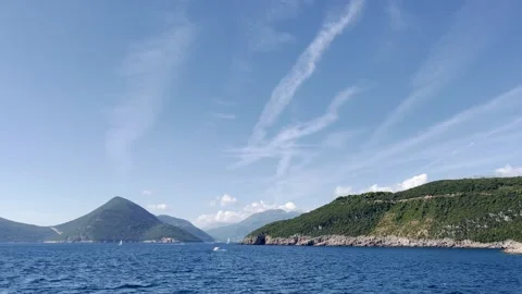A ship sails through the Mediterranean Sea to the entrance of the Boko Kotor Bay Stock Footage 256817827