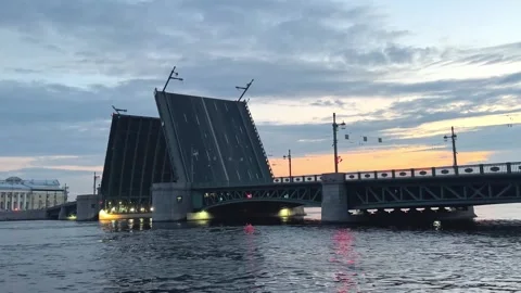 Ship sails through an open Palace drawbridge in St. Petersburg at sunrise. Neva  Stock Footage 314467545