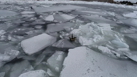 The ship sails through the sea ice in the winter. child pirate ship in ice. Stock Footage 87858345