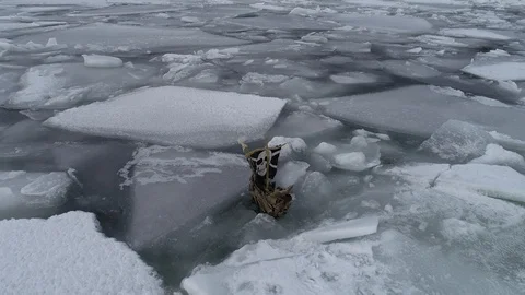 The ship sails through the sea ice in the winter. child pirate ship in ice. Stock Footage 87858743