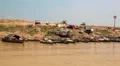Ship sails to the Tonle Sap lake in Siem Reap province, Cambodia HD Footage