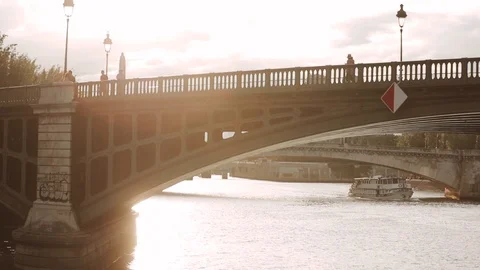 The ship sails under the bridge overlooking Notre Dame Stock Footage 124046974