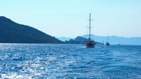 The ship sails on the waves in the blue sea Stock Footage 263181219