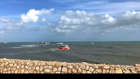 Ship on the sea and waves under the clouds and blue sky Stock Footage 101011973
