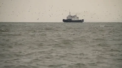 The ship in the sea on the horizon. Mainly cloudy. Sea. Wind. Russian Crimea. 動画素材 69745995