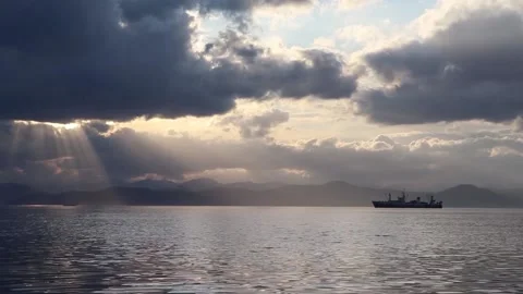Ship at sea with mountains in the background Stock Footage 142611583