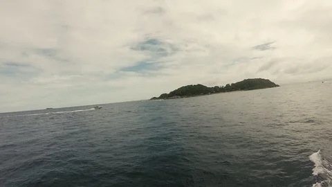 On a ship in the sea overlooking the island Stock Footage 103449936