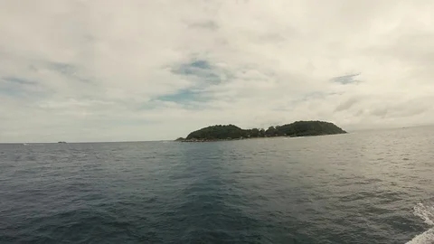 On a ship in the sea overlooking the island Stock Footage 103449939