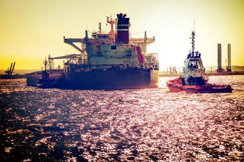 Ship on sea at sunset Stock Photos