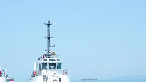 Ship in seaport, deck bathed in summer sunlight, calm and serene... Stock Photos