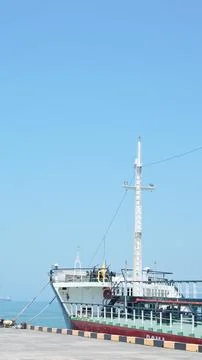 Ship in seaport, deck bathed in summer sunlight, calm and serene... Stock Photos