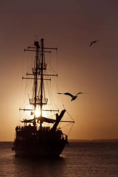Ship silhouette at sunset Stock Photos