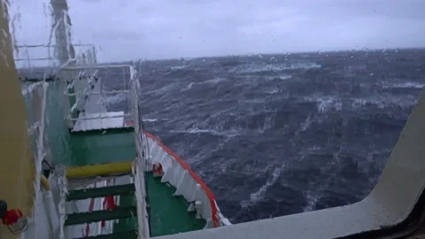 Ship in storm. A lot of splashes. View from bridge. Ship climb up wave. Strong 스톡 동영상 165953866